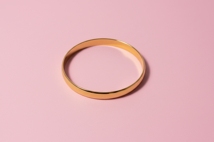 Gold bracelet on a white background